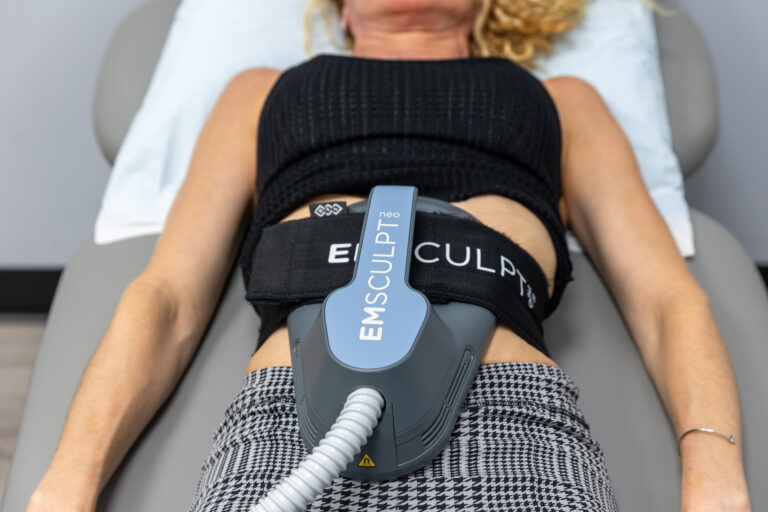A woman receives Emsculpt NEO treatment to enhance her results from GLP-1 Weight Loss