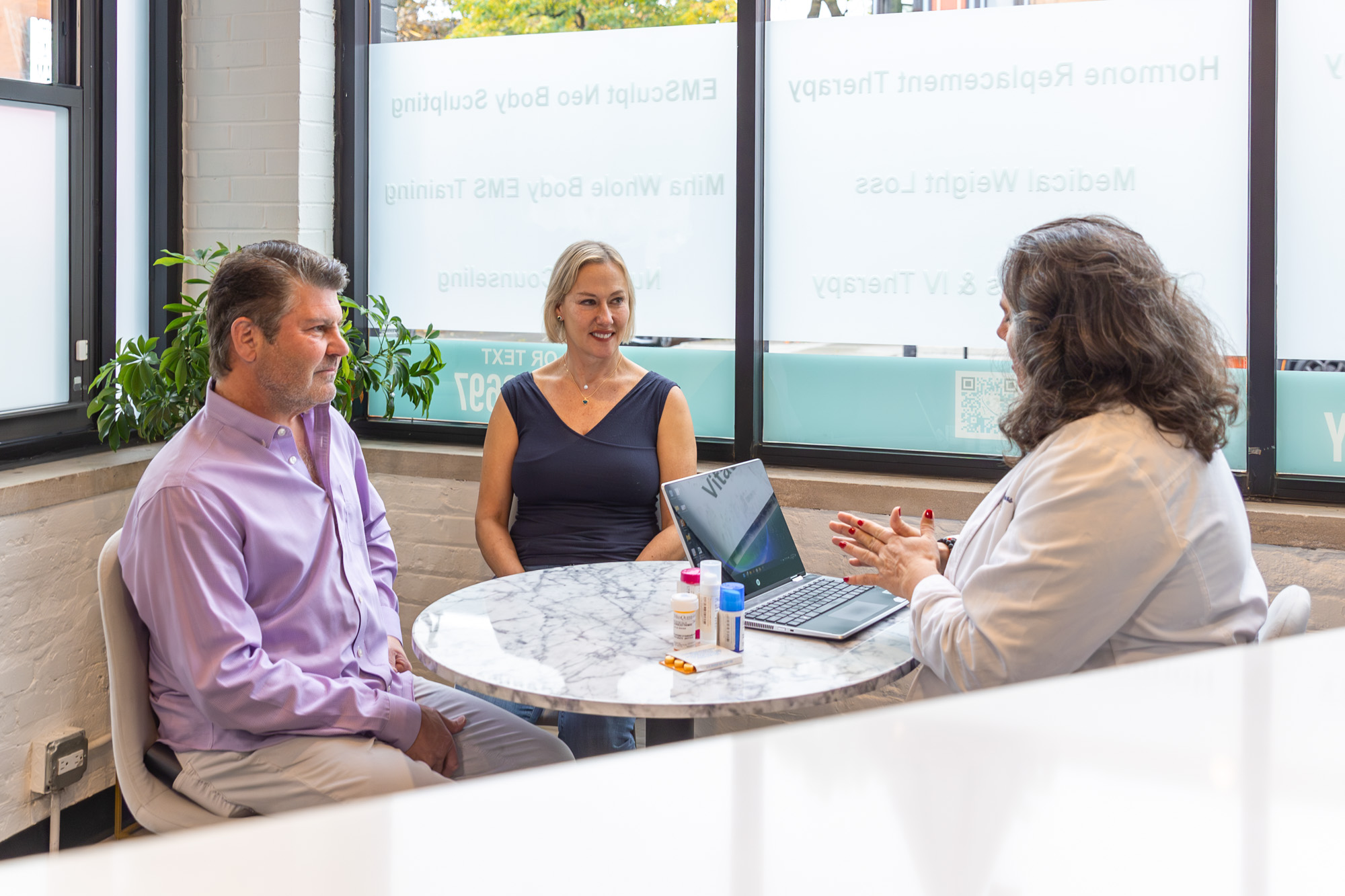 a woman with her husband learning about hormone therapy at balance flow in chicago