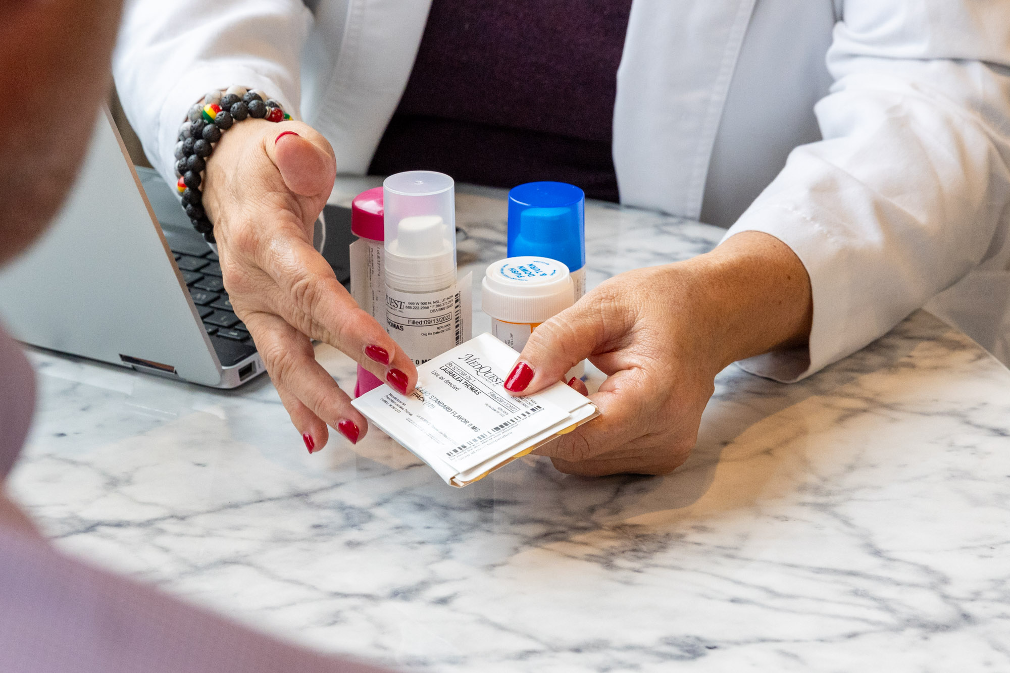 a doctor offers hormone replacement medication to patient